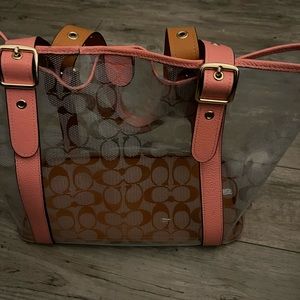 Transparent Coach tote and cosmetic bag